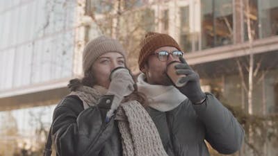 Romantic Couple with Coffee Outdoors.