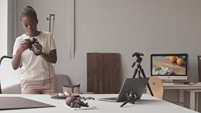 Black Female Food Photographer at Work.