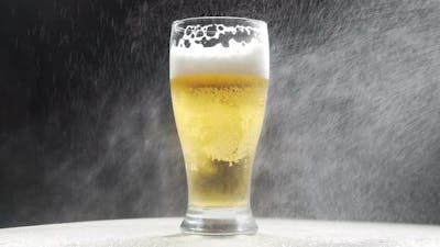 Cold Beer In A Glass With Water Drops. Craft Beer Close Up. Like rain water.