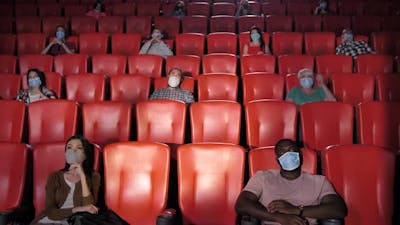 Diverse People in Movie Theater During Coronavirus.