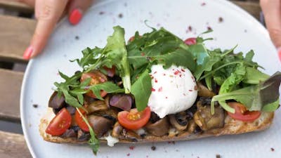 Sandwich with Mushrooms Tomatoes Mozzarella and Salad.