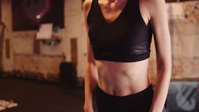 Woman Stretching at Gym.