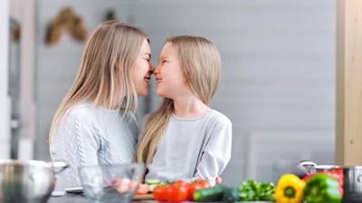 Mother and Daughter are Making a Salad for Lunch for Their Family.