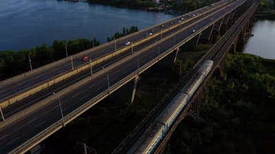 Top View of Moving Train on the Rivers Bridge.