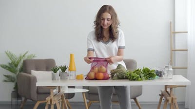 Young Cute Woman Preparing To Cooking a Salad.