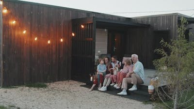 Big Family Sitting on Porch.