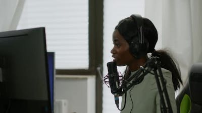 Sad Black Woman Streamer with Headphone Losing Videogames.