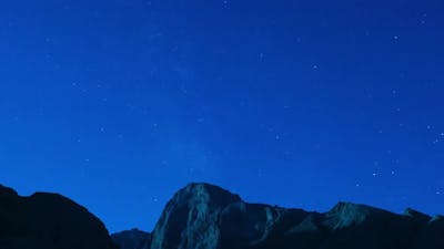 Time lapse of a starry night sky clouds.