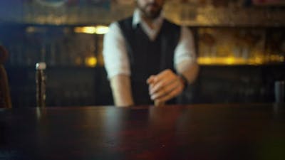 Bartender Serving Customers in Pub Puts Pint of Beer.