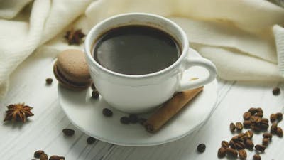 Cup of Coffee with Spices and Macaron.