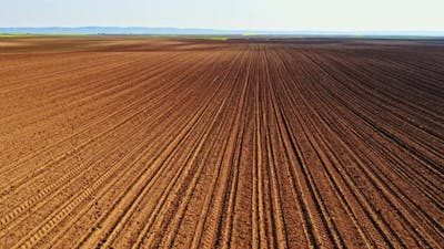 Drone shot of ploughed corn field.