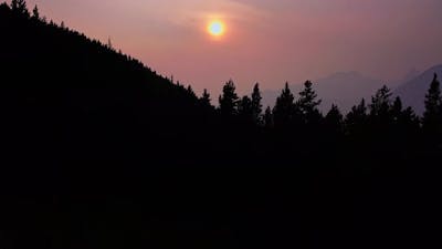 Sun in forest and the mountains.