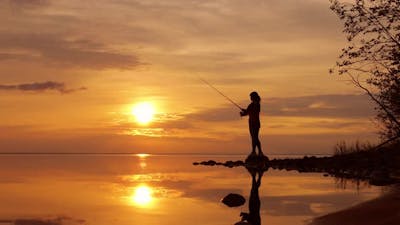 Woman Fishing on Fishing Rod Spinning.