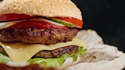 Yummy Hamburger, Fast Food Concept. Fresh Homemade Grilled Burger with Meat Patty, Tomatoes.