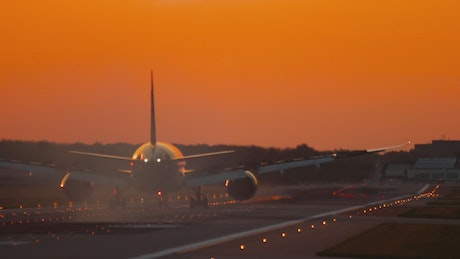 Airplane moving trough the airport track in the morning.