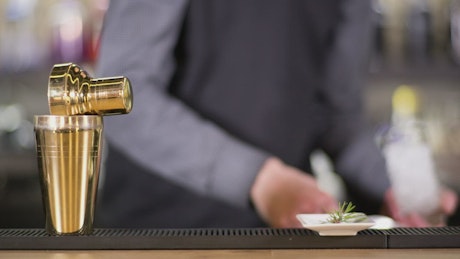 Bartender preparing a cocktail.