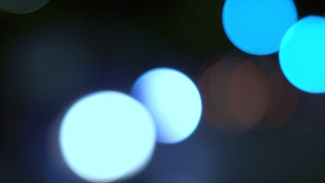 Blurred abstract cars lights at night with bokeh effect.