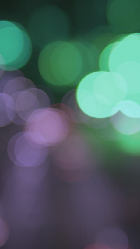 Blurred green and purple lights bokeh.