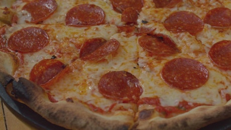 Close up shot of a pepperoni pizza.