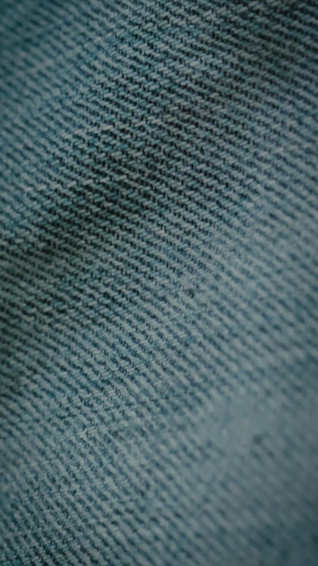 Close view of denim fabric texture.