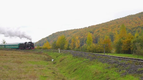 Old steam train approaching.
