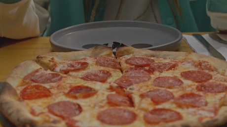 Portrait of a young man eating pizza.