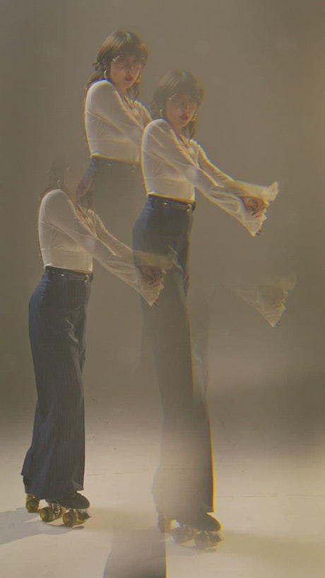 Reflection effect of a young woman dancing in rollerblades.