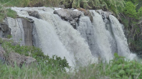 Rocky waterfall on a river in nature.