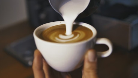 Serving a sparkling cappuccino in a cup.