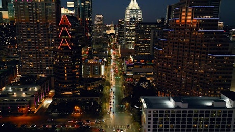 Side by side aerial view of a city at night.