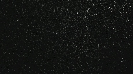 Snowing with dark background.