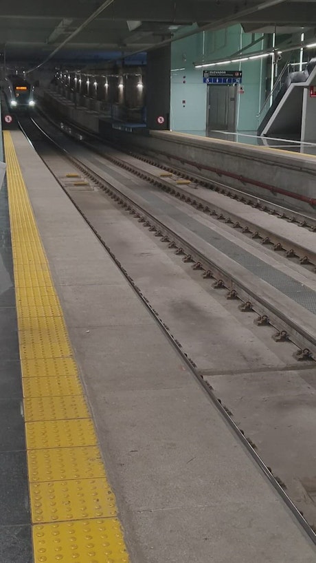 Subway line arriving at an underground station.