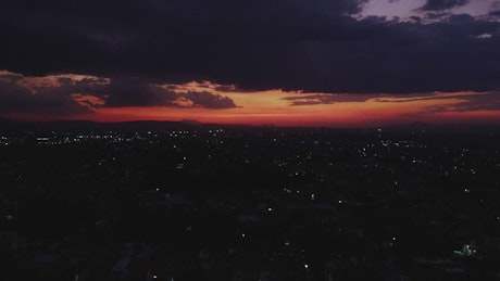 Tour high above a city at dusk.