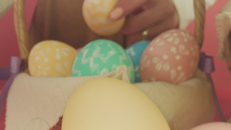 Woman places decorations for Easter.