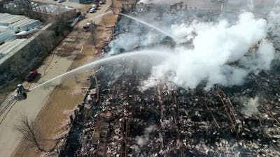 Aerial View of Firemen Fighting with Fire Near Biulding.