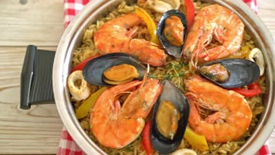 Seafood Paella with prawns, clams, mussels on saffron rice - Spanish food style.