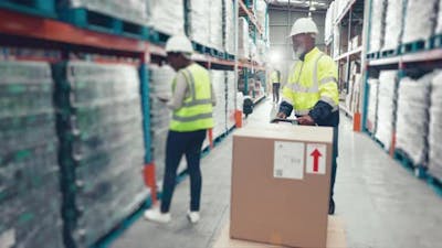 Boxes, factory trolley and black man transport product, cardboard package.