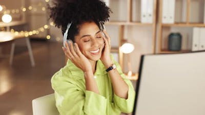 Business woman, music and dancing at computer in night office for happiness.