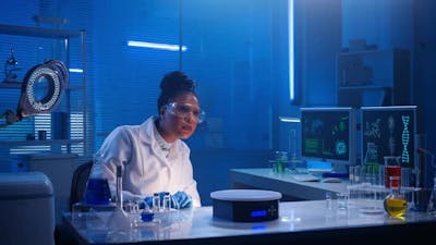 An African American Woman Examines Virtual Graphics Zoomes the Picture.